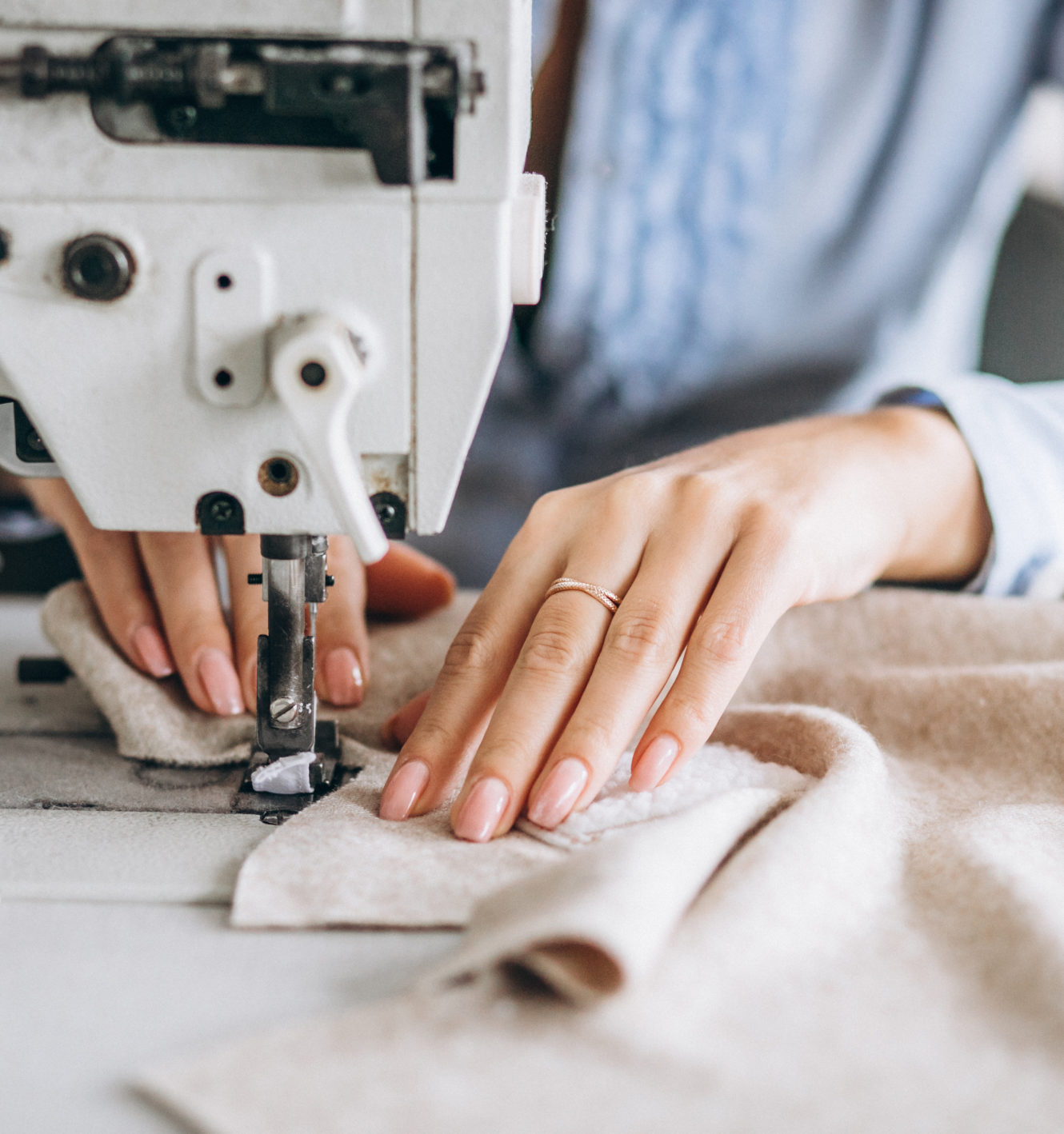 Woman tailor working at the sewing factory